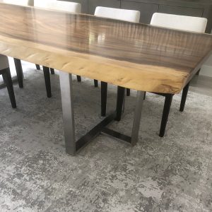 Brushed Stainless T-Shaped Legs on a Live Edge Wood Dining Table