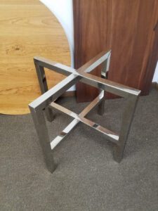 Polished stainless steel metal trestle base for glass top