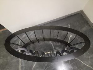 Top down view of elliptical metal furniture base