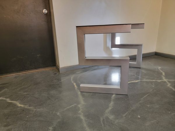 S-Shaped metal entryway table legs for stone top