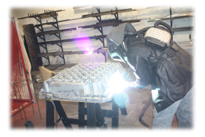 Picture of Evan Condron welding aluminum